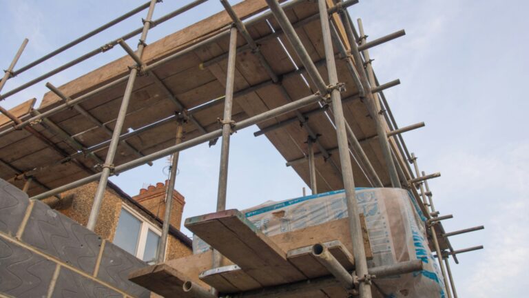 a house extension during construction surrounded by scaffolding