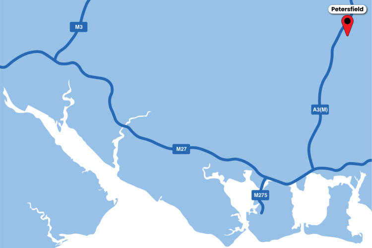A blue and white map of the south coast with a red marker and text box for Petersfield