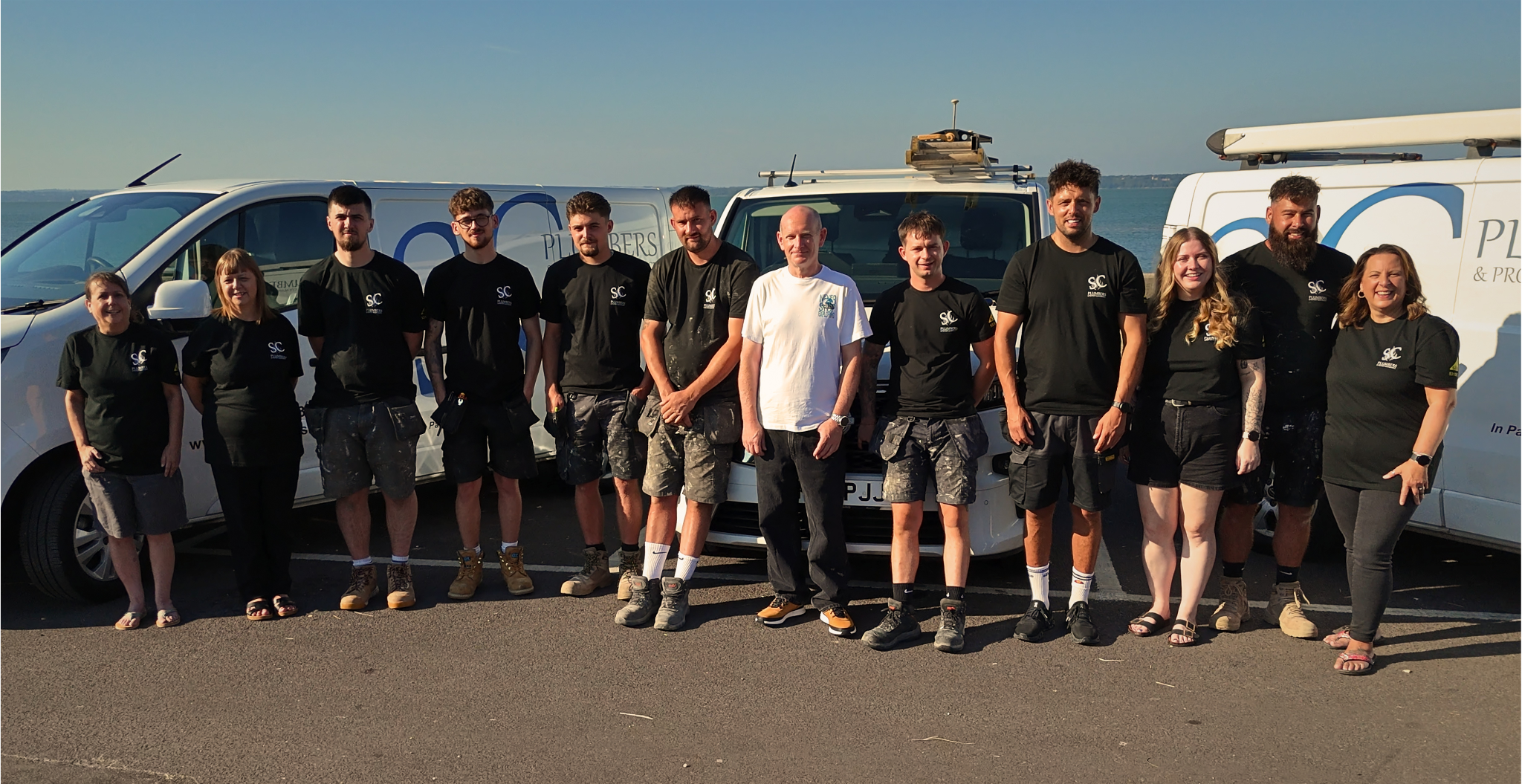 Sc Plumbers team photo 2026 Sc Plumbers Team Photo Outside in front of company vans